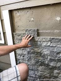 Showing how to install the stone veneer. Airstone Faux Stones On Concrete Wall Install Stone Panels Exterior Faux Stone Walls Diy Stone Wall