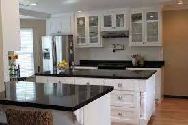 Deciding on warm or cool tones in your color palette is an essential first step. 20 Modern Kitchen Designs With Black Countertops Antique White Kitchen Cabinets White Cabinets Black Countertops White Granite Countertops