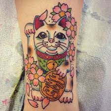 Wanderlust Tattoo Company On Instagram One Of The First Tattoos Done In The New Shop Can T Believe It S Been Over A Yea Lucky Cat Tattoo Cat Tattoo Tattoos