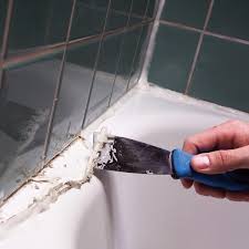 The caulk remover works by destroying the bond between the caulk and the tub or tile, so that instead of chipping at the caulk with a razor blade, you just pull away big chunks of it with a putty knife. How To Remove Caulk From Tub Diy Family Handyman