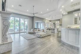 Sometimes, we just need a change in our homes, and there's nowhere better the walls are a light gray with the bright white lamps reflecting brightly off of them. Grey Hardwood Floors How To Combine Gray Color In Modern Interiors Living Room Flooring Wood Floor Kitchen Home Decor