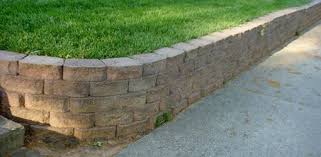 How To Build A Stackable Block Retaining Wall Today S Homeowner Garden Retaining Wall Building A Retaining Wall Landscaping Retaining Walls