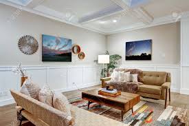 Check spelling or type a new query. Lovely Craftsman Style Living Room With Coffered Cealing Over Light Beige Walls With Board And Batten Wood Paneling Comfortable Sofa Adorned With Pillows And Taupe Shag Throw Blanket Northwest Usa Stock Photo