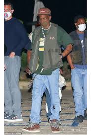 We've got hype bottoms starting at $35 and plenty of other bottoms. Travis Scott Rocks Olive Green Vest And Light Wash Baggy Jeans While Hanging Out With Friends In Nobu Malibu Report Minds