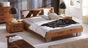unser bett mit kuhfell kopfteil aus eiche santar rustikales bett rustikales holzbett rustikale schlafzimmermobel