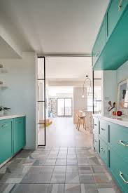 The bismark blue and leather brown in this kitchen create a refined and natural aesthetic. 6 Colorful Kitchen Ideas Valeria Crescenzi