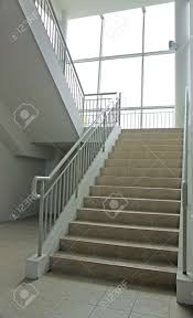 It makes it possible to create a room under the stair. Stairwell With Wide Staircase And Full Length Glass Windows Leading Stock Photo Picture And Royalty Free Image Image 4191033