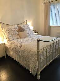 Elizabeth is a professional seamstress and makes window treatments and bedding for designers and her own clients. Beautiful Metal Bed Frame With Homemade Lace Valance Bed Skirt Bedroom Decor Dream Bedroom Metal Bed Frame