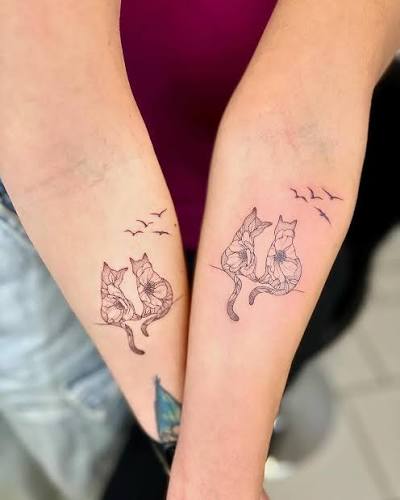 🌸🐱 **Matching Tattoos Alert!** 🐱🌸 Meet two lifelong best friends who just took their friendship to the next level with the most adorable matching tattoos! 💖 These beautiful pieces feature two cute