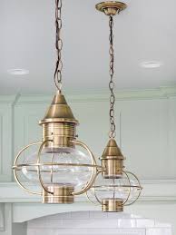 Steal style ideas from this airy beach retreat. Lakefront Cottage Kitchen Makeover Hanging Lights Hanging Lights Kitchen Beach House Decor