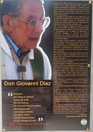 Un murale dedicato a Don Giovanni Diaz, nella piazza Santa Rita di  Medadeddu, frazione di Carbonia, a 12 anni dalla morte