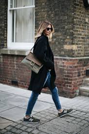 Emma Hill Wears Black Winter Coat Ripped Skinny Jeans Khaki New Balance Trainers Khaki Chloe F Sporty Chic Outfits Workout Outfits Winter New Balance Outfit