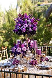 12 Stunning Wedding Centerpieces Part 15 Belle The Magazine Purple Wedding Centerpieces Purple And Gold Wedding Dark Purple Wedding