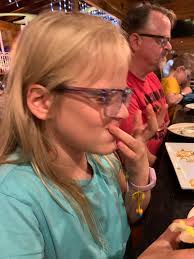 Father and son enjoy sushi dinner together
