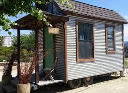Outside, you'll notice a knotty pine exterior, modern charcoal grey trim, a funky roofline, and a permanent bump out over the trailer hitch. Tiny Houses On Wheels We Love Bob Vila