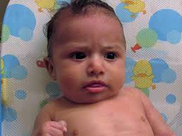 4k00:25authentic close up shot of a cute newborn baby in a white bathrobe is having fun with his mother after bathing and smiling. Bathing A Clubfoot Baby Writing Mother Fashionista