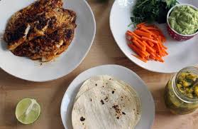 Add the fish taco seasoning as a dry rub and pat it to cover the fish. Blackened Fish Tacos With Mango Salsa