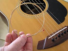 If you're changing an intact guitar string you will need to loosen the string and then cut it in two. When To Replace Guitar Strings