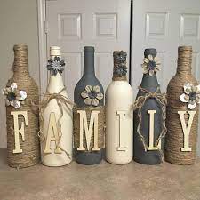 Wine Bottle Decor Hand Painted Family Custom Decorated Wine Bottles Cream And Grey In Color Christmas Wine Bottle Crafts Diy Wine Bottle Diy Crafts Wine Bottle Crafts Christmas