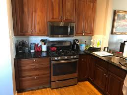 Dark Countertop with Two-Tone Cabinets (White and Blue)