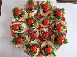 Cherry Tomatoes And Black Olives Make Really Cute Lady Birds Base Is Made Up Of Sliced Bagettes Cream Cheese Smoked Sal Food Kids Party Food Food Decoration