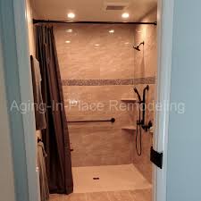 This Bathroom Remodel Created A Wheelchair Accessible Roll In Shower The Shower Include Grab Bars And A Hand Held Shower Unit Shower Wheelchair Shower Seat Shower Units
