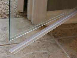 How To Clean The Plastic Strip At The Bottom Of A Glass Shower Door Cleaning Glass House Cleaning Tips Glass Shower Doors