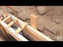 I am planning to add a small stem wall at the corner so i can get the siding elevated and away how can i support the corner to the building when i have the framing cut back to pore the new stem wall? Foundation And Stem Walls Youtube