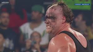 He wears a black suit with gold armor pieces over his body, with his most. Kane Enters Wwe Hall Of Fame Wbir Com