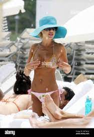 Exclusive!! Ever the exhibitionist Shauna Sand changes bikinis in plain  view on Miami Beach. The crafty ex Playmate bought a new bikini from a  beach seller and put the new camouflage one