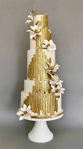 Availability Of Cake Decorators Might Be Limited At The Bakeshop Of Your Option An Early Chat With The Cak Gold Cake Decorations Modern Wedding Cake Gold Cake