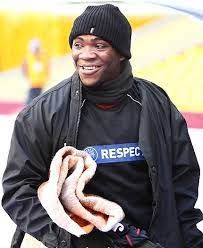 An individual who harbors the specific organisms of a disease without manifest symptoms and is capable of transmitting the infection; Ola John Wikipedia