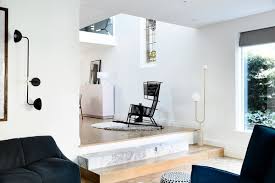 In this living room, a burnished metal chandelier supplies overall light and visual interest. Best 2 Modern Living Room Floor Lighting Marble Floors Design Photos Dwell
