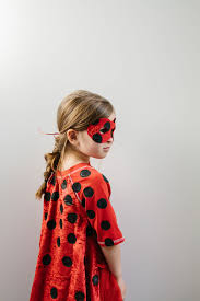 Create red ladybug wings with black spots using fabric or cardboard and make a. Kids Ladybug Costume Diy The Effortless Chic