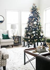 Adding lots of lights, candles, & a faux fireplace can bring warmth to your living room. Simple And Elegant Christmas Living Room This Is Our Bliss