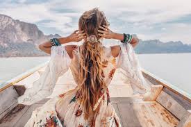 Fashionable young model in boho style dress on boat at the lake. A Beginner S Guide To Boho Style Fashion Gone Rogue