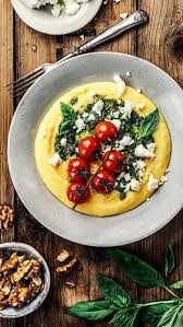 Creamy Polenta With Green Pesto Baked Tomatoes Sheep Cheese Recipe Vegetarian Recipes Vegetarian Dishes Healthy Recipes