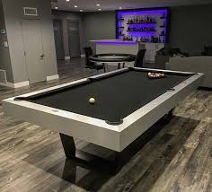 Playing Billiards Is A Past Time Favorite For Most Men And Is Considered One Of The Best Entertainment Activity Pool Table Game Room Basement Modern Pool Table