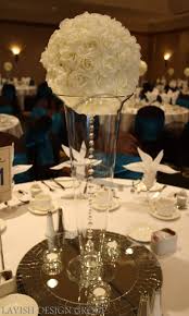 What do you do with a rose centerpiece? Cream Rose Ball With Hanging Crystal Gem Gold Wedding Centerpieces Rose Centerpieces Wedding Wedding Decorations Centerpieces