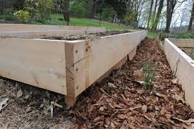 Do you want to learn how to build a fence on a slope? Gardening On Uneven Ground Leveling Raised Beds A Way To Garden