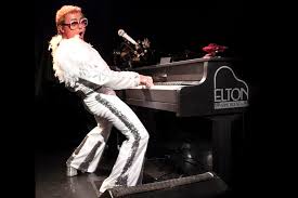 Soulful english singer who moved from simple, sensitive piano rock to become a glamorous music superstar. Young Elton Explored At Az Broadway Features Peoriatimes Com