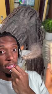 Guy Combs His Dreads