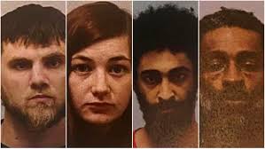 Four suspects charged, two sought in Greenville robbery