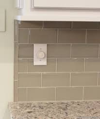 White Painted Kitchen With Black Island Village Home Stores Kitchen Tiles Backsplash Glass Subway Tile Backsplash Kitchen Upgrades