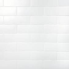 This warm and inviting kitchen blends white cabinets with a green crackle subway tile backsplash. London White 3x9 Ceramic Subway Tile For Walls Tilebar Com