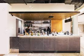 Create a tranquil space to start your day with a minimalist coffee bar. Black White And Wooden Industrial Decorated Interior Design Coffee Bar Decorated With White Granite And Concrete Counter With Moving Baristas Stock Photo Picture And Royalty Free Image Image 139857733