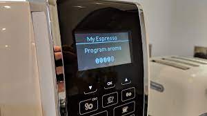 This silver coffee machine is an. De Longhi Dinamica Review