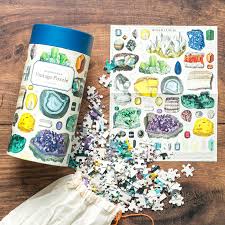 Assorted 1000 piece puzzles featuring vintage imagery. Mineralogy 1000 Piece Jigsaw Puzzle By Cavallini Co