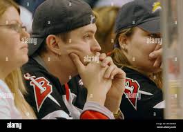 Buffalo Sabres fans CJ Clark, left, and Laura Ahrens of Dunkirk, N.Y.,  watch as the Buffalo Sabres lose to the Atlanta Thrashers 5-4 in a shootout  in an NHL hockey game at