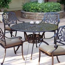 Metal chairs, on the other hand, come in a wide variety of finishes to add a modern splash to your outdoor decor. Elisabeth 4 Person Cast Aluminum Patio Dining Set With 48 Round Series 2000 Table Antique Bronze Zenpatio